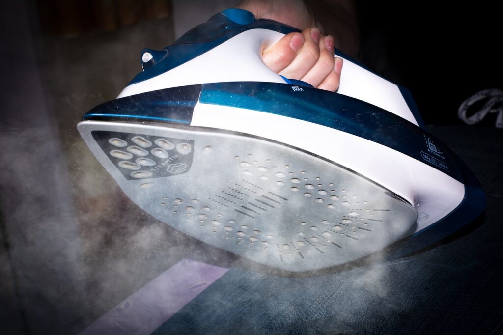 Ironing and steaming the newborn baby clothes for extra care.